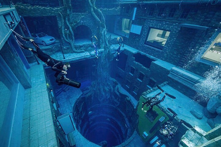 Dive into a surreal underwater city exploring art-filled walls and abandoned buildings beneath 60 meters of crystal-clear water all while soaking in the innovation of a unique marine environment.